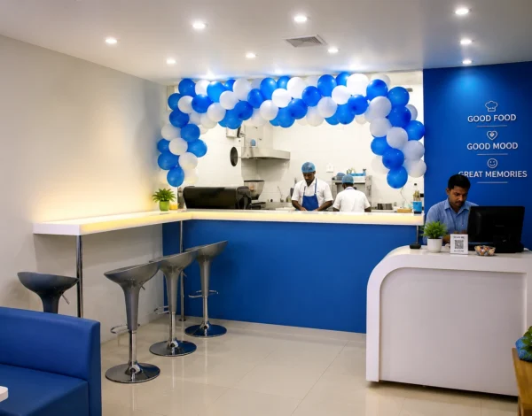 Modern café reception and service counter designed by Grand Archinex with contemporary interiors, customer seating, and premium hospitality design.